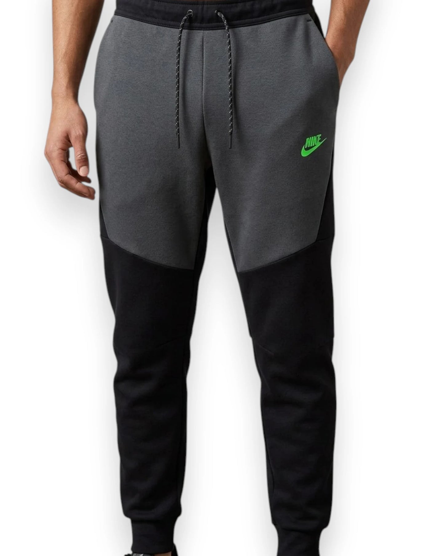 Gray and black Nike jogger pants on a white background
