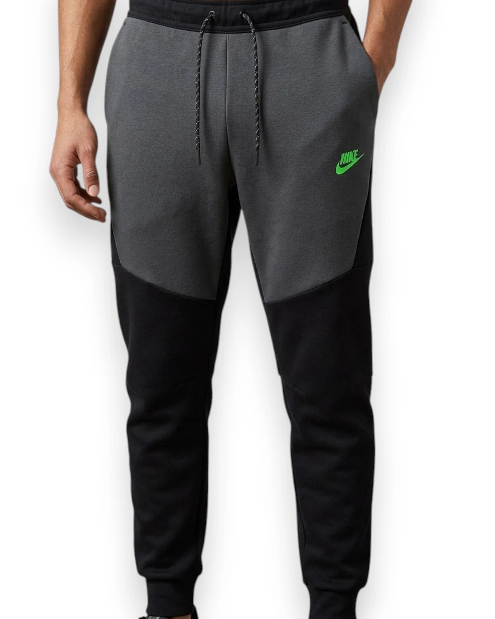 Gray and black Nike jogger pants on a white background